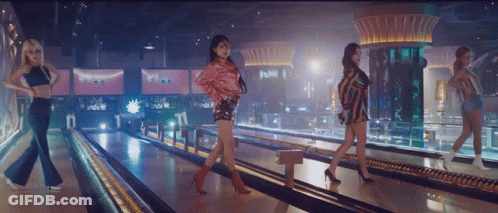 Four Women Are Walking Down A Bowling Alley GIF