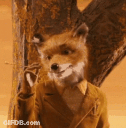 Fox In Suit Standing Next To Tree Smiling GIF