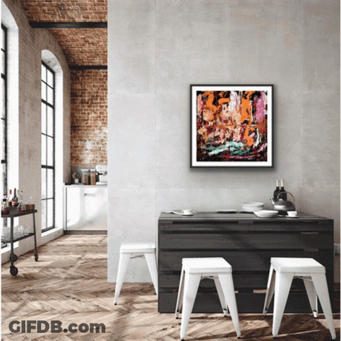 Framed Painting Hangs Above Table GIF
