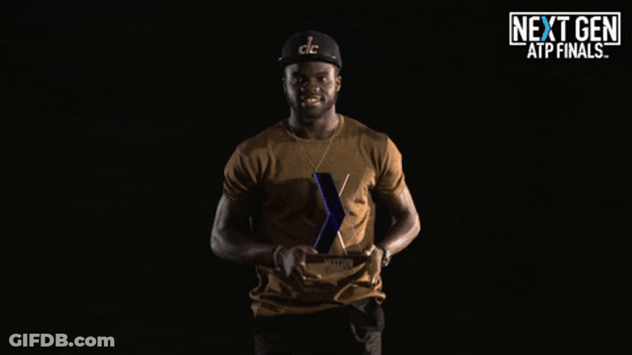 Francis Tiafoe Holding A Trophy GIF