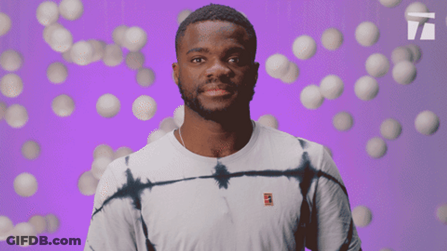 Francis Tiafoe Showing Off Muscles GIF