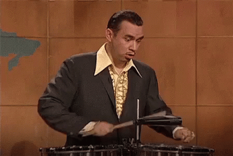Fred Armisen Holding Rim Shot Stick GIF