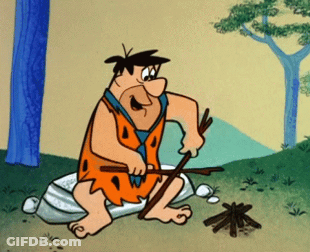 Fred Flintstones Making Campfire GIF