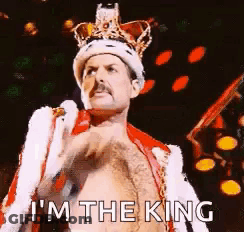 Freddie Mercury Wearing Crown And Coat GIF