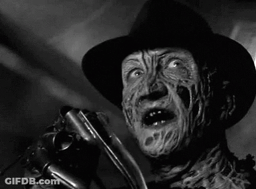 Freddy Krueger Holding Knife Black And White GIF