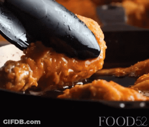 Fried Chicken Scooped From Pan With Tongs Food52 GIF