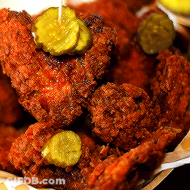 Fried Chicken With Pickles On A Stick In A Basket GIF