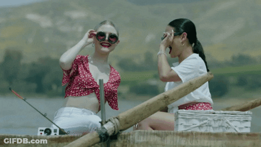 Friends Riding Skiff Surrounded Swimmers Doing Exercises GIF