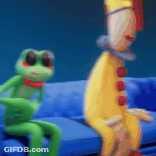 Frog And Clown Sitting On Couch GIF
