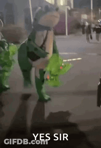 Frog In Green Costume Walking Down Street Saying Yes Sir GIF