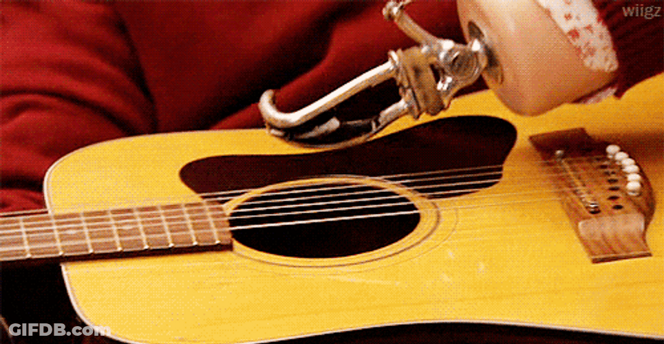 Frustrated Guitar Strumming GIF