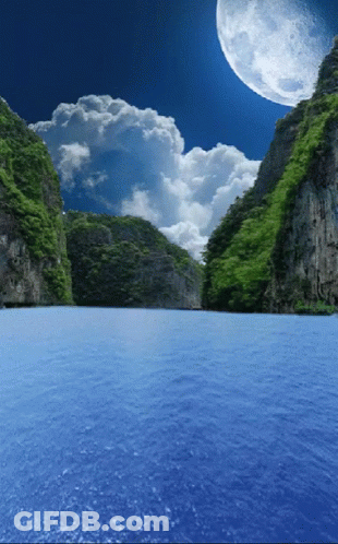Full Moon Over Lake Surrounded By Mountains GIF