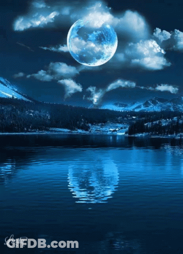 Full Moon Reflected In Water With Mountains GIF