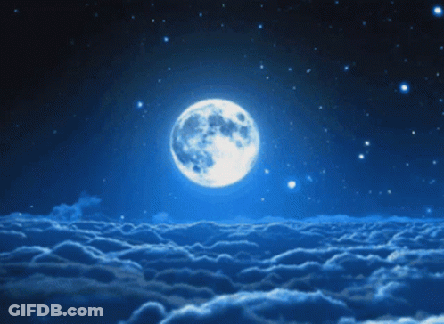 Full Moon Rising Over Cloudy Night GIF