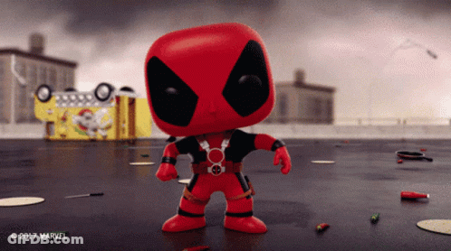 Funko Pop Deadpool In Front Of Yellow Truck GIF