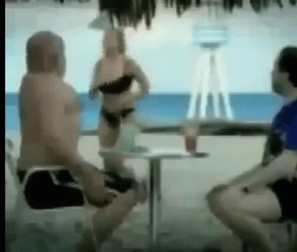 Funny Beach Men Looking At A Woman GIF
