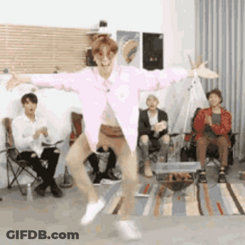 Funny Dance In Front Of Seated Friends GIF