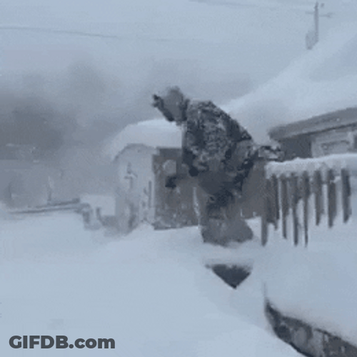 Funny Guy Diving In Snow Storm GIF