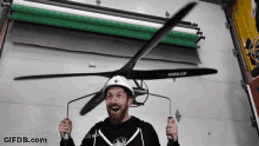 Funny Guy Flying Using Helicopter Propeller GIF