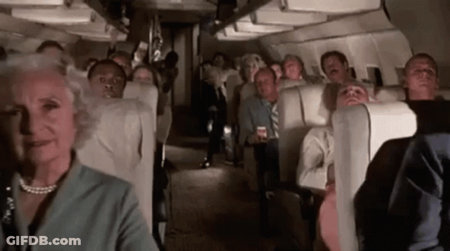 Funny Guy Just Appeared On Plane Ceiling GIF