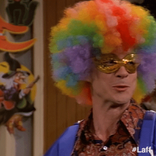 Funny Guy Sporting Vibrant Rainbow Afro GIF