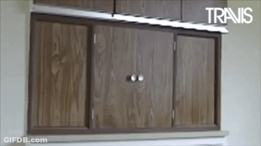 Funny Happy New Year Cupboard Surprise GIF