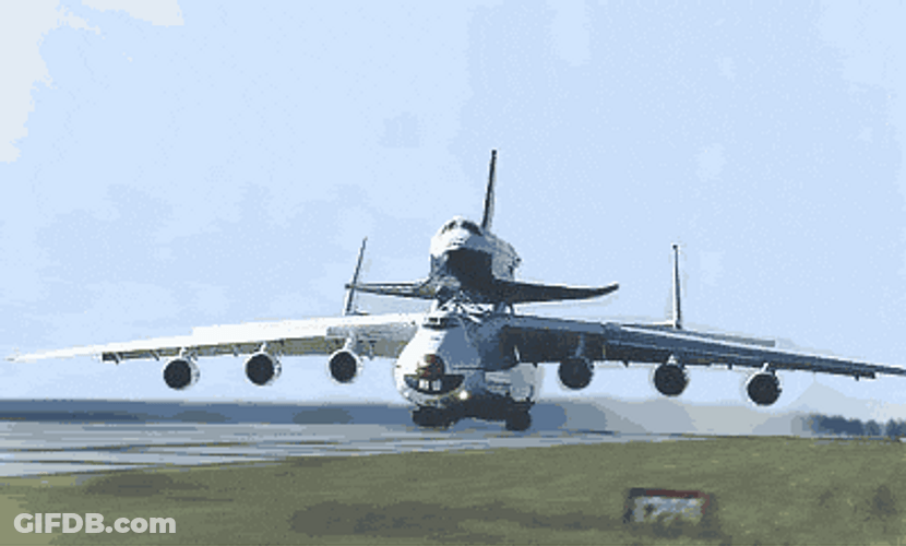 Funny How This Plane Give Piggyback Ride To Smaller Plane GIF