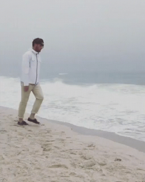 Funny Man Disappearing On Beach Sand GIF