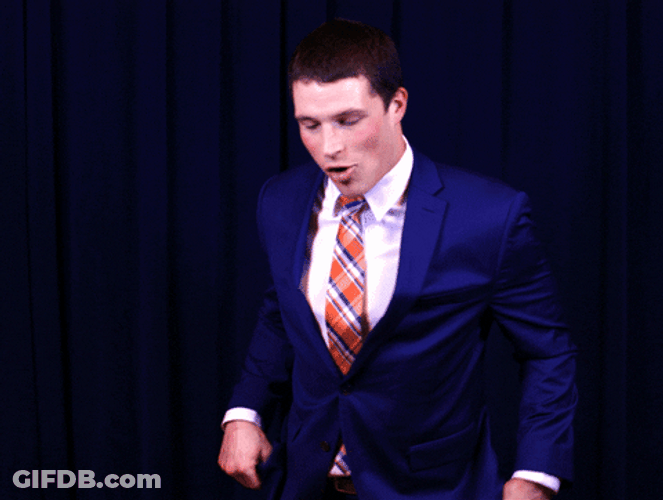 Funny Man Making Wacky Heisman Pose GIF