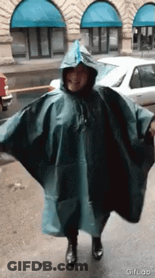 Funny Rain Dancing Lady Wearing Raincoat GIF