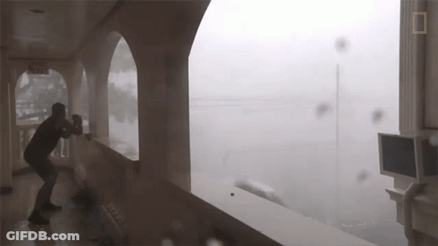 Funny Rain Storm Man Hiding GIF
