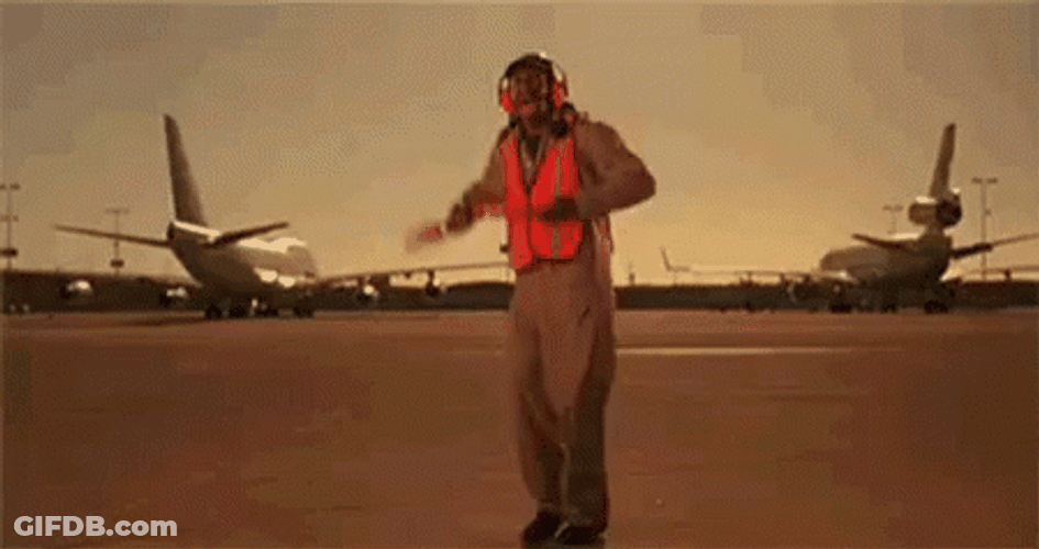 Funny Runway Worker Dance While Guiding Plane GIF
