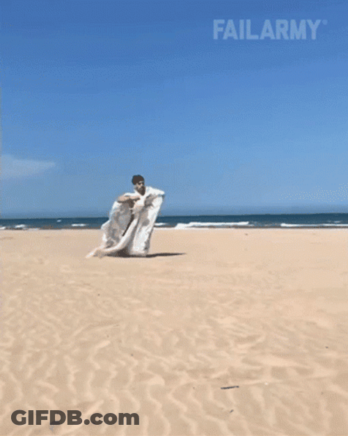 Funny Sack Race Beach Faceplant GIF