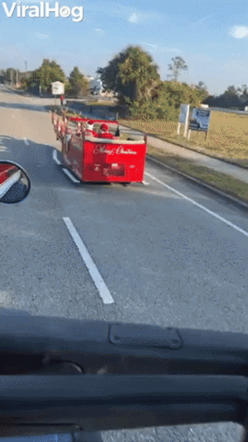 Funny Santa Riding Modern Sleigh GIF