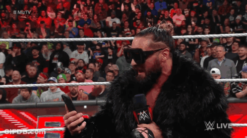 Fur Coat Announcer At Wrestling Show GIF