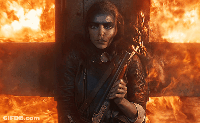 Furiosa Hiding Behind Big Fence GIF