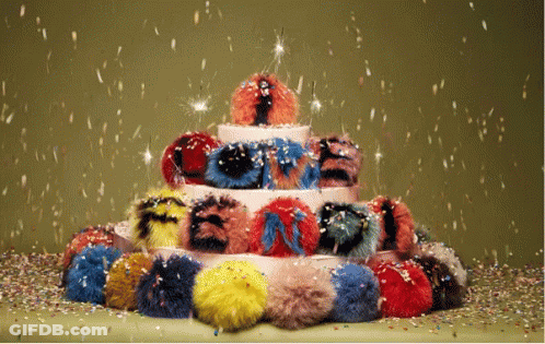 Furry Pom Pom Birthday Cake With Confetti GIF
