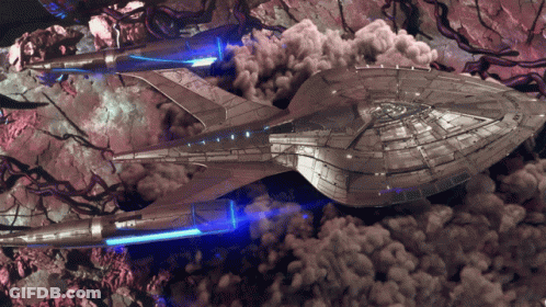 Futuristic Spaceship Flying Through Smoke GIF