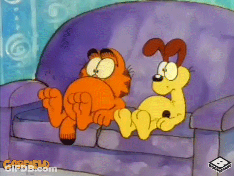 Garfield And A Dog Are Sitting On A Couch Together GIF