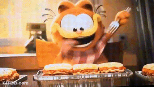 Garfield Is Holding A Fork And Eating A Tray Of Food . GIF