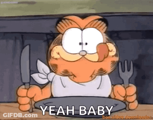 Garfield Is Holding A Knife And Fork In Front Of A Plate And Says Yeah Baby GIF