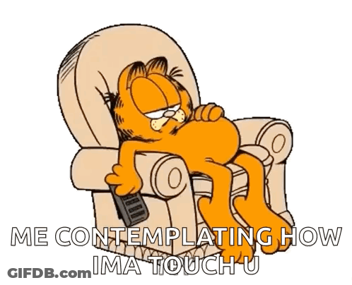 Garfield Is Laying In A Chair With A Remote Control In His Hand GIF