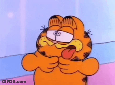 Garfield Is Making A Funny Face With His Tongue Hanging Out . GIF