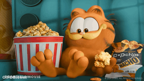 Garfield Sits Next To A Bag Of Nacho Chips And A Bucket Of Popcorn GIF