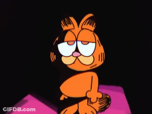 Garfield The Cat Is Sitting On A Pink Pillow With His Eyes Closed And A Sad Look On His Face . GIF