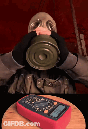 Gas Mask Man Drinking Can With Digital Multimeter GIF