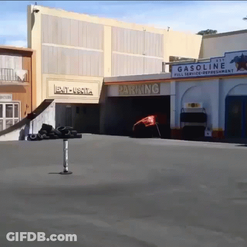 Gas Station With Parking Sign GIF