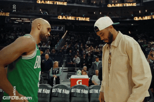 Gatorade Cooler Between Two Basketball Players GIF
