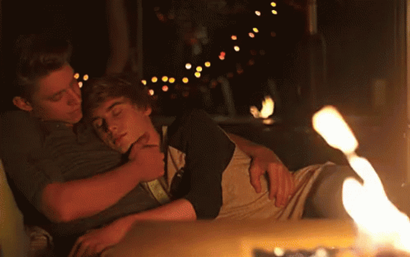 Gay Couple Cuddle In Bonfire GIF