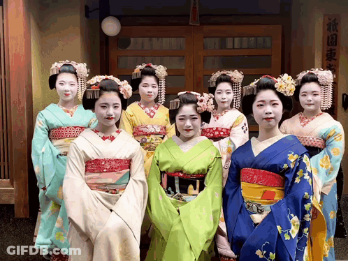 Geishas Posing For Photo In Front Of Building GIF
